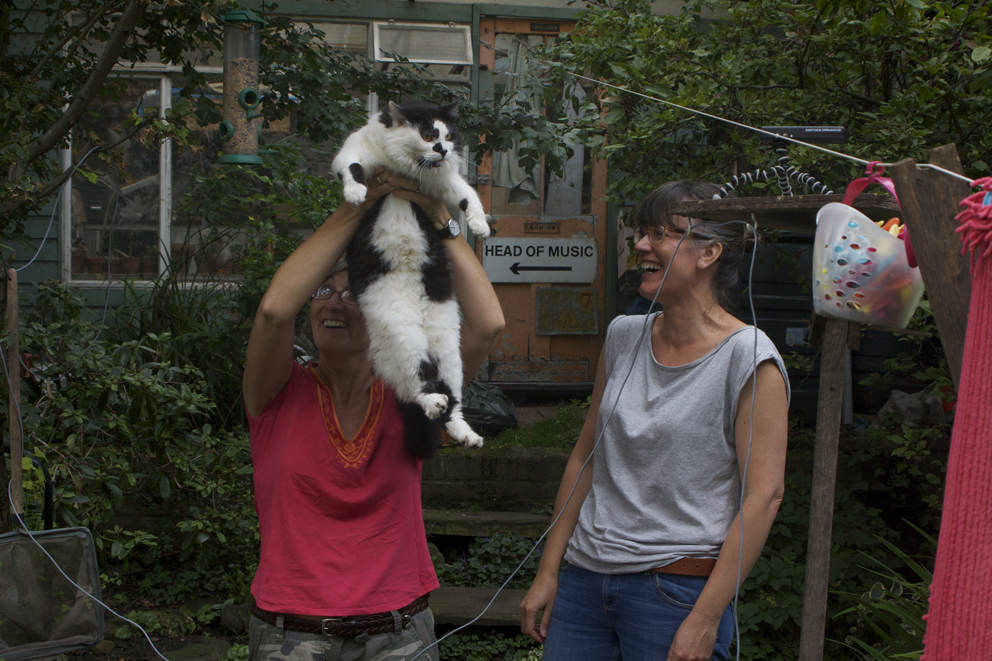 Women and cat in garden