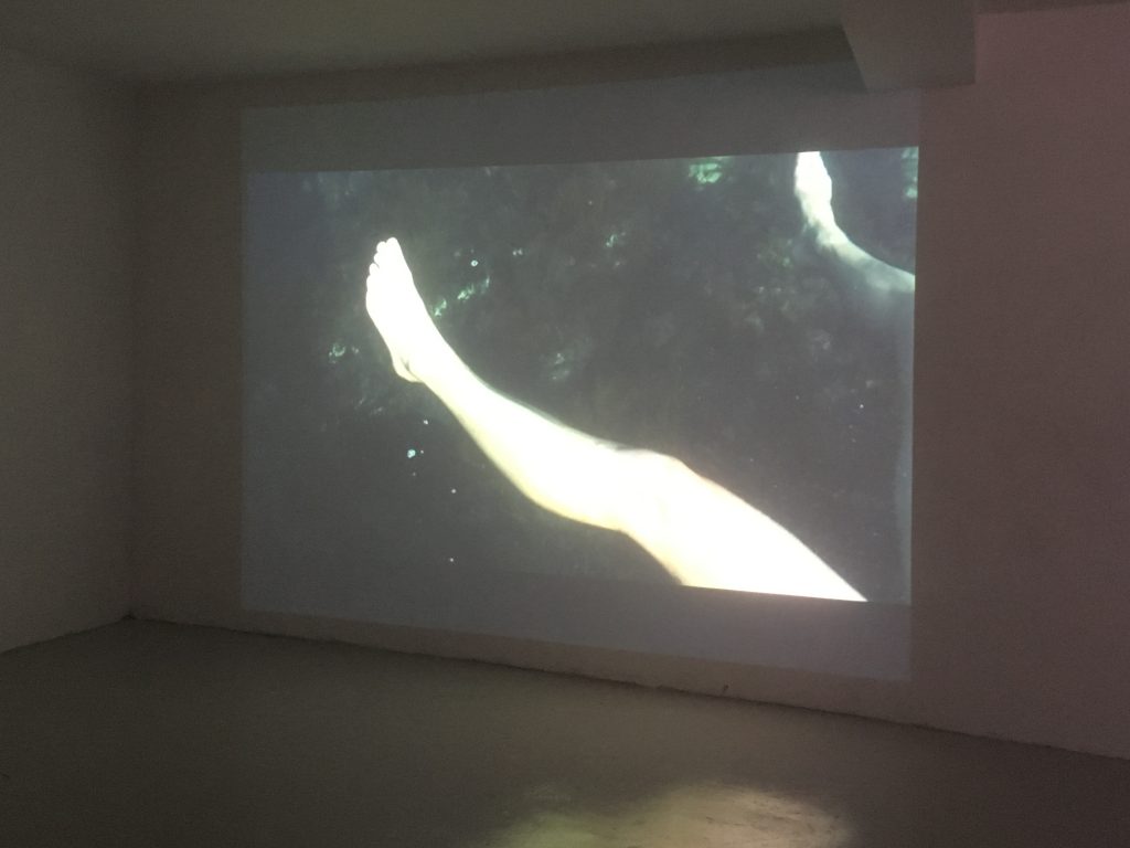 Video still of two legs apart in the sea